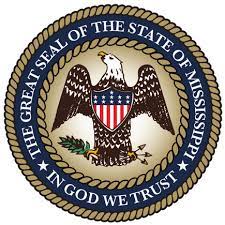 Mississippi State Seal. Features an Eagle holding a branch and arrows with the words "The Great Seal of the State of Mississippi" and "In God We Trust" in a circular banner. 