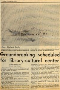 A newspaper clipping dated October 24, 1975, featuring an artist’s sketch of the planned Biloxi Library-Cultural Center above an article announcing the upcoming groundbreaking ceremony. The article describes the $1.6 million project, its location on Lameuse Street, and details about the event and planned features of the new facility.